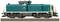 A model train at a scale of 1:87 shows a green and beige diesel locomotive on tracks with a detailed chassis view.