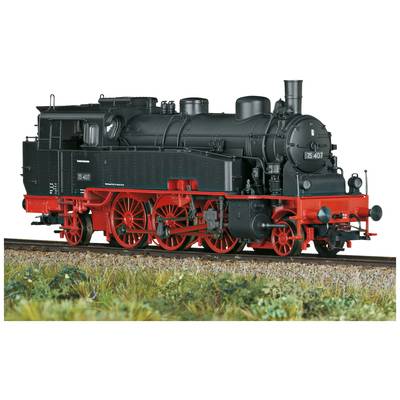 Black steam locomotive with red wheels and details stands on a railway track. Model number '75 407' is visible on the locomotive.