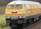 A yellow model locomotive on a section of railway track. It bears the emblem 'HF' and the number '320 001-1'. Blurred in the background.