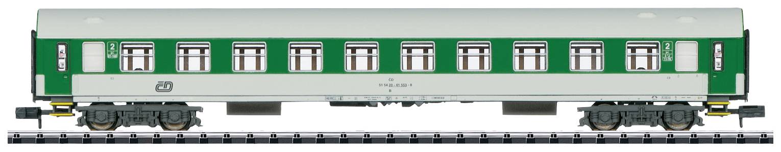 A green model train passenger carriage on a track. The carriage has a white roof surface and several windows on each side.