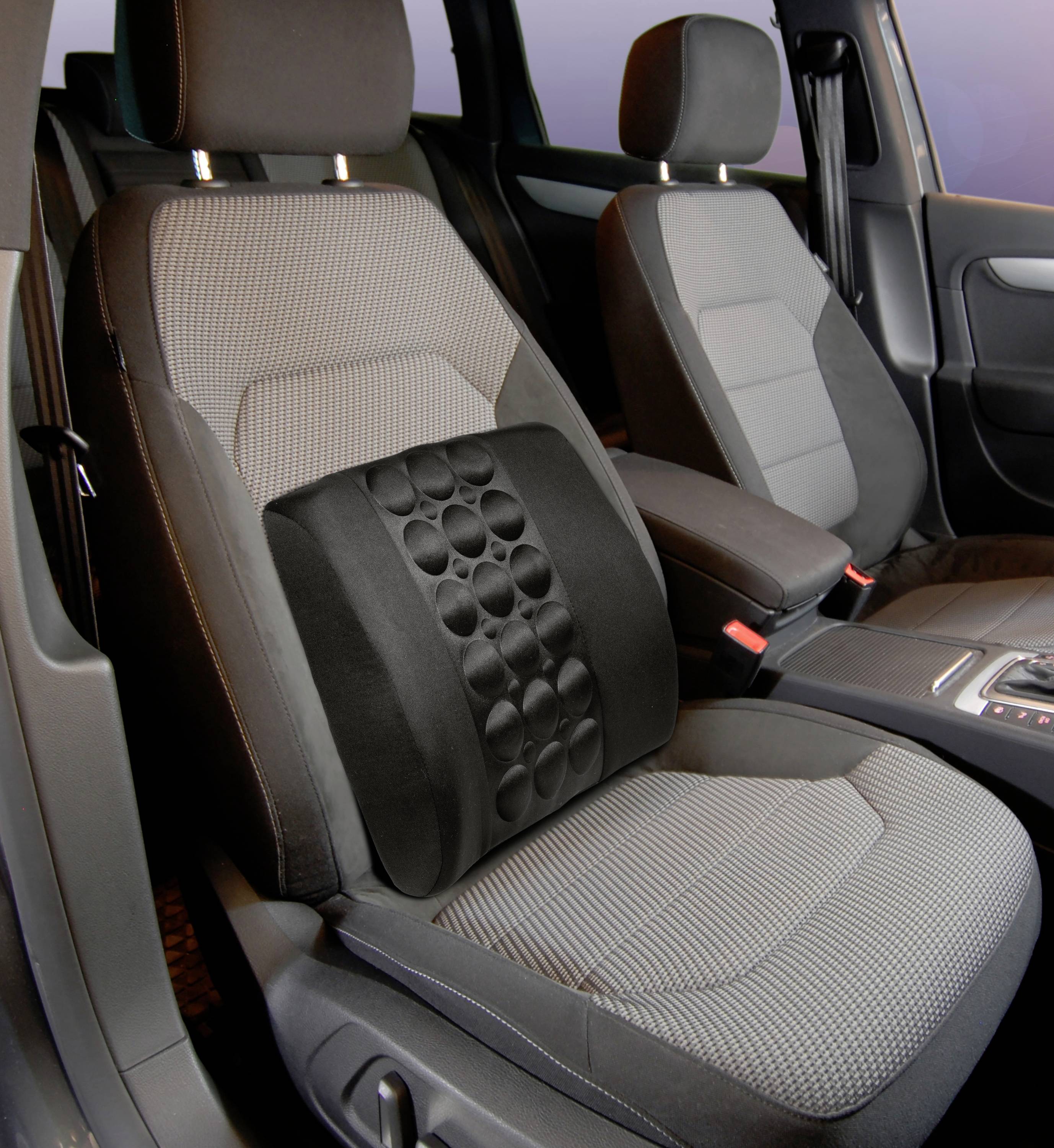 Car seat with an ergonomic lumbar support cushion that supports the lower spine. Cushion has a circular pattern for enhanced ventilation.