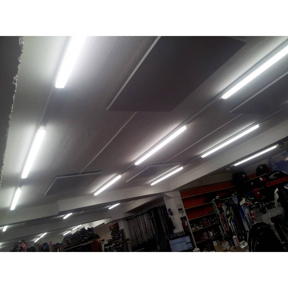 Illuminated shop with ceiling-mounted fluorescent lights. Shelves in the background displaying various products.