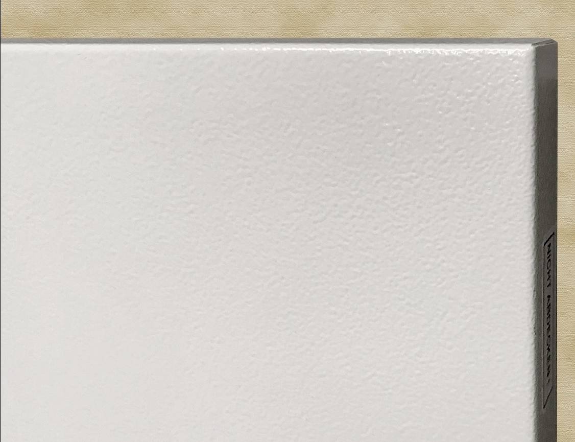 White, structured surface against a blurred beige background.