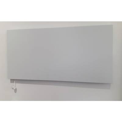 A flat, rectangular heating panel on the wall with a white electrical cable hanging from it.