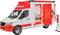 A white and red ambulance with its side door open, with a paramedic standing beside it.