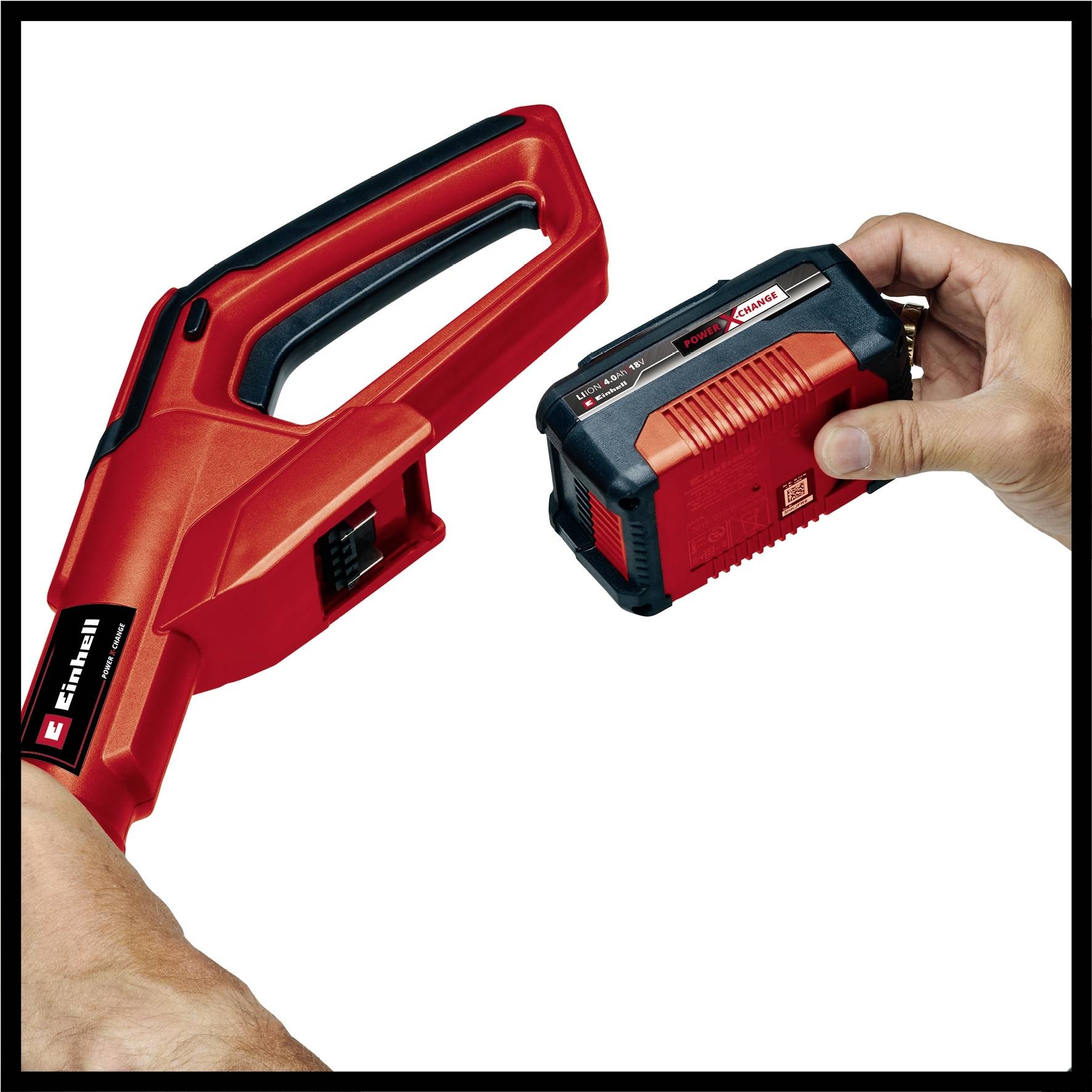 A red electric garden secateur is being fitted with a rechargeable battery by a person. Both hands are visible.