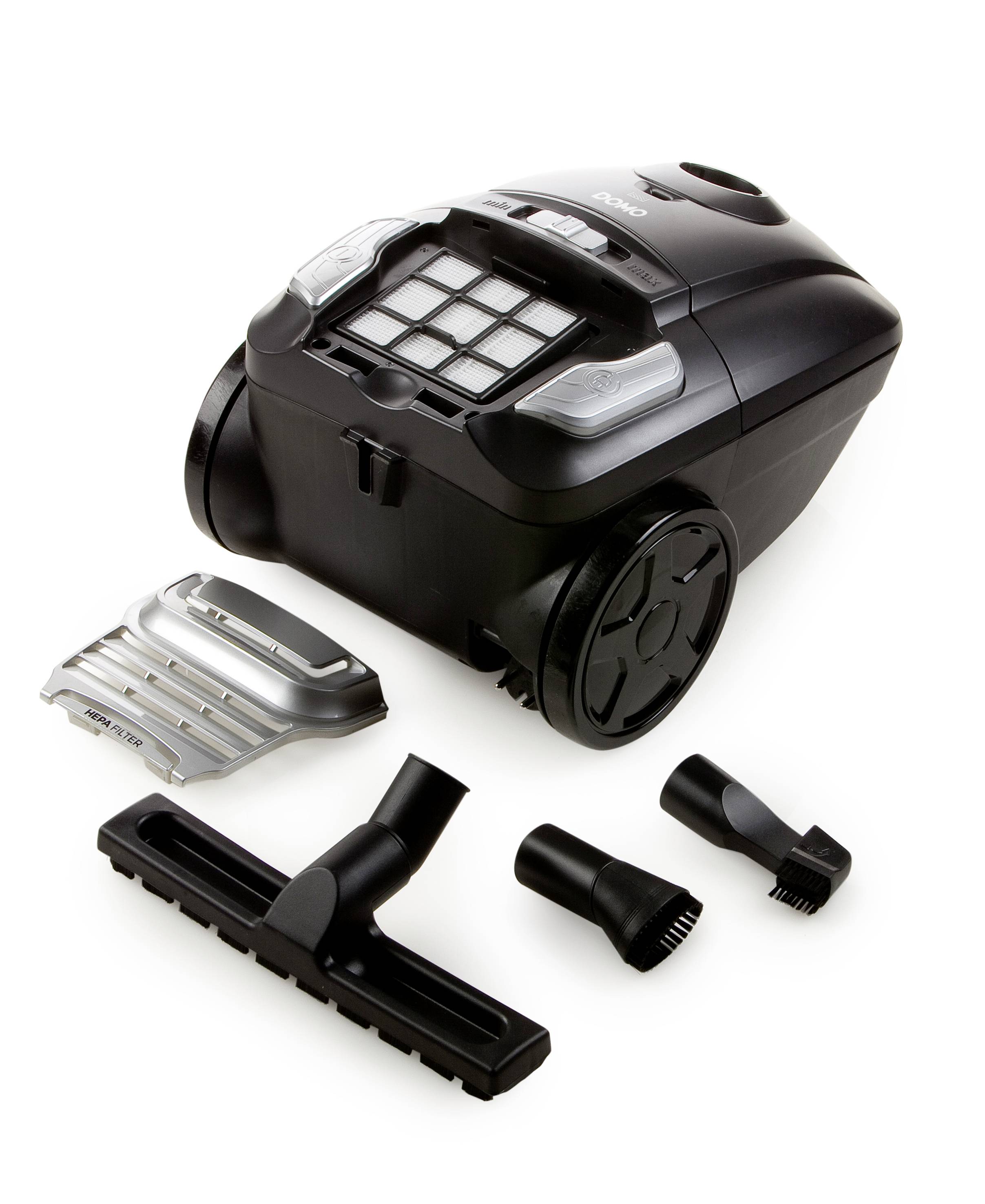 Black vacuum cleaner with various attachments, including a floor nozzle and two brush heads, on a white background.