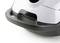 A grey-black vacuum cleaner, close-up of the lower section with casing and handle visible.