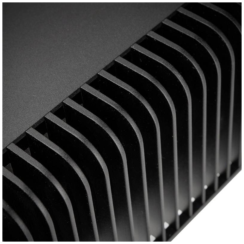 Close-up of cooling fins on a black metal heatsink. The image depicts the structure and arrangement of the fins.