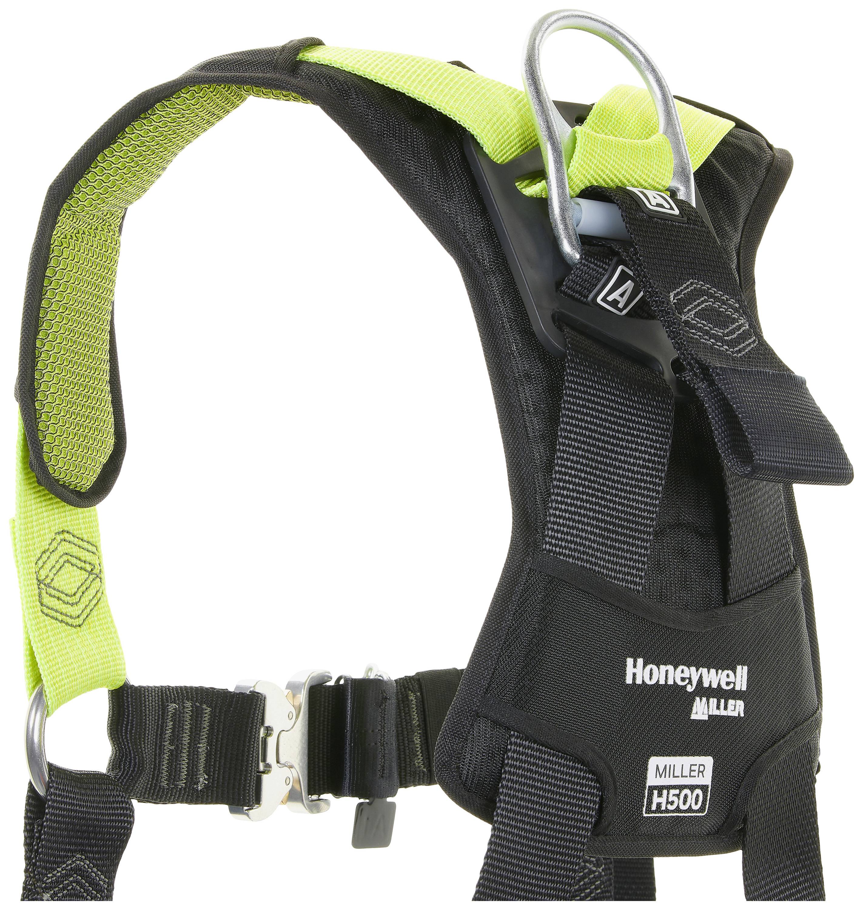 Safety harness with green padding and metal rings, 'Honeywell Miller H500' model, for fall protection in industry.