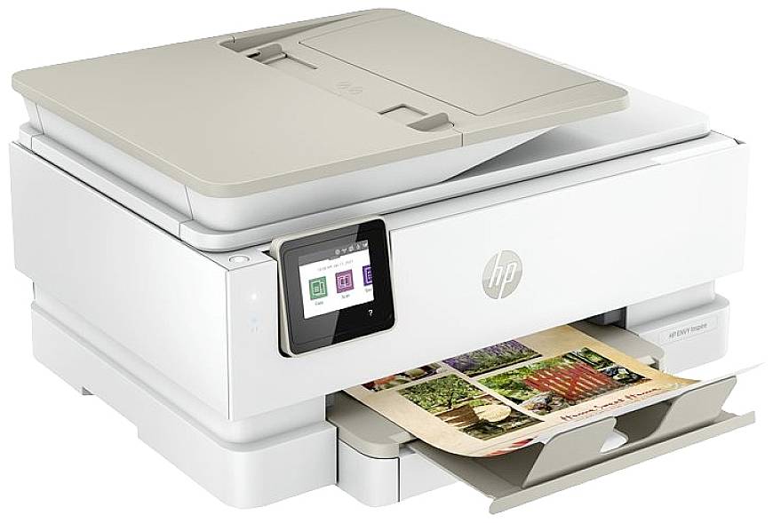 A white multifunction printer with a touchscreen displays the menu. It is printing a colour photograph.