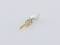 A small, metallic connector with a golden tip and silver casing on a white background.