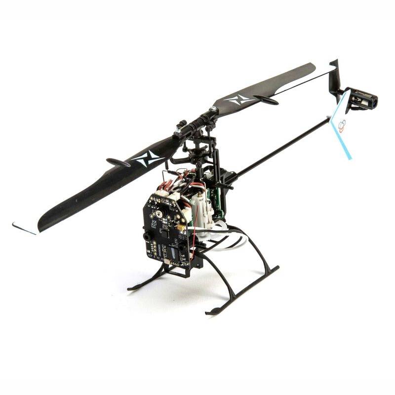 Small, black remote-controlled helicopter with visible electronics and a white cog wheel on the rotor blades.