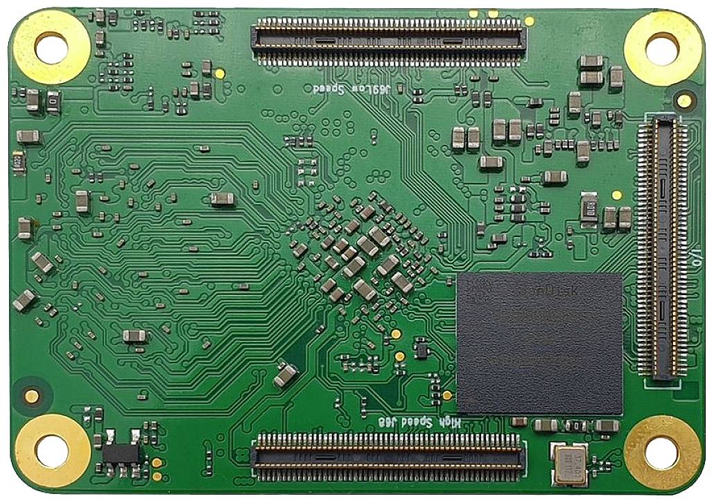Green electronic circuit board with various circuits and components, including chips and connective interfaces at the corners.