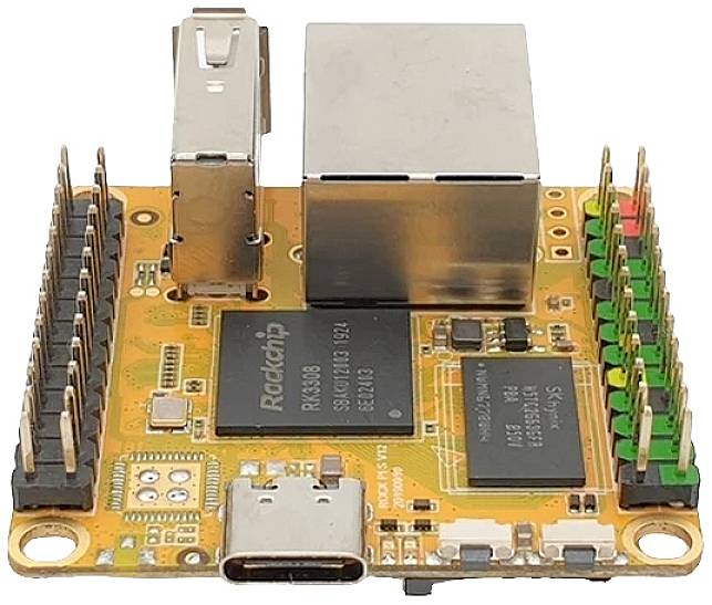 A small computer module with various chips and interfaces, including USB and Ethernet ports, along with LED indicators.