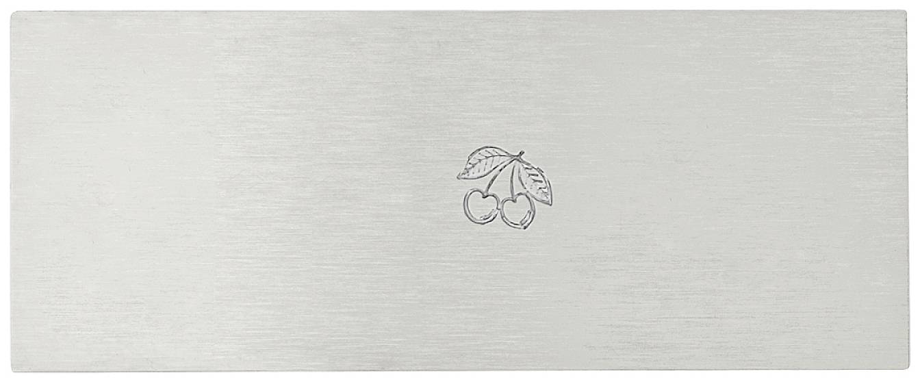 A rectangular metal plate with two engraved cherries in the centre, surrounded by a single-coloured, textured surface.