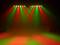 Red and green stage spotlights illuminate an empty space. The lights create a colourful and festive atmosphere.