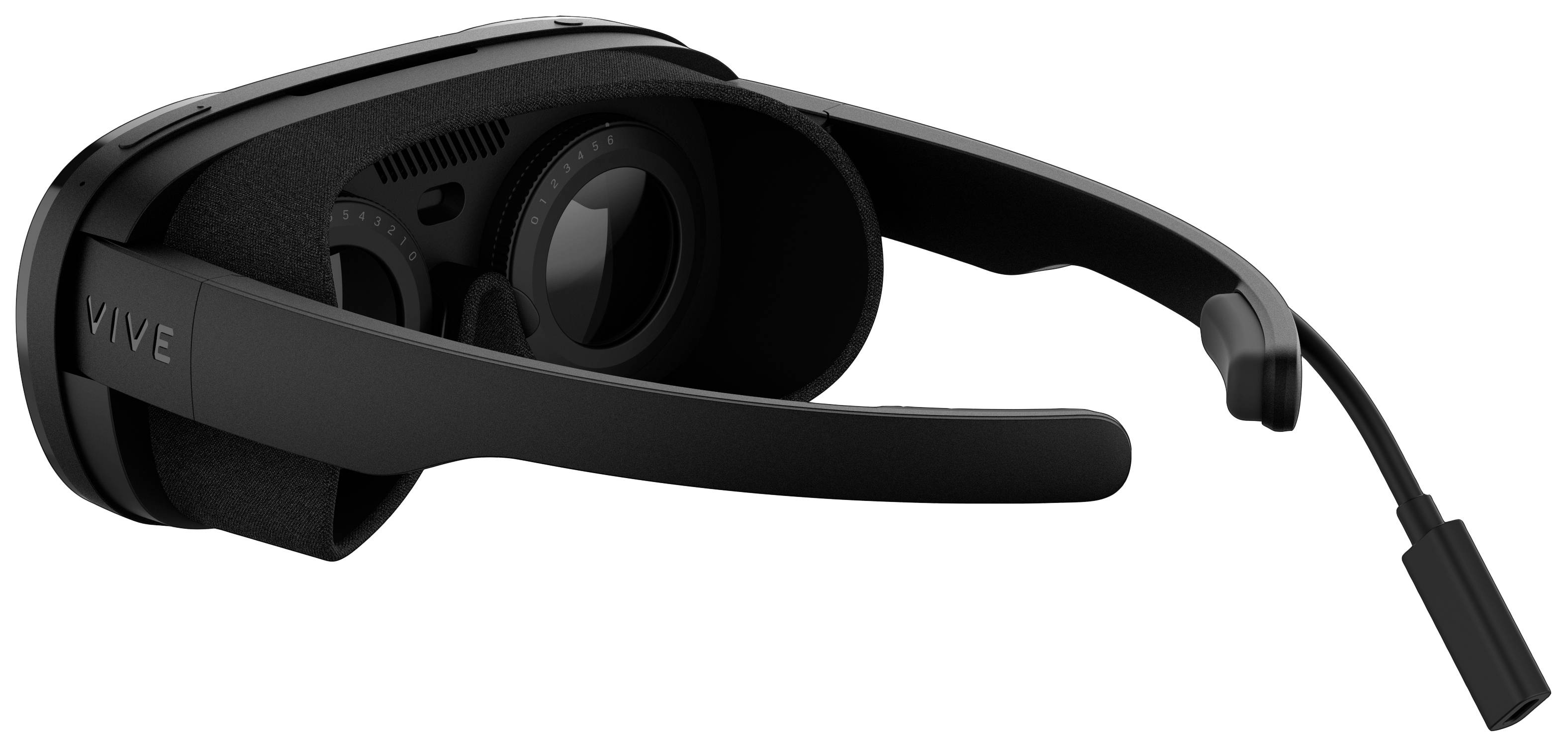 Black virtual reality headset viewed from the side, with head strap and lenses visible.