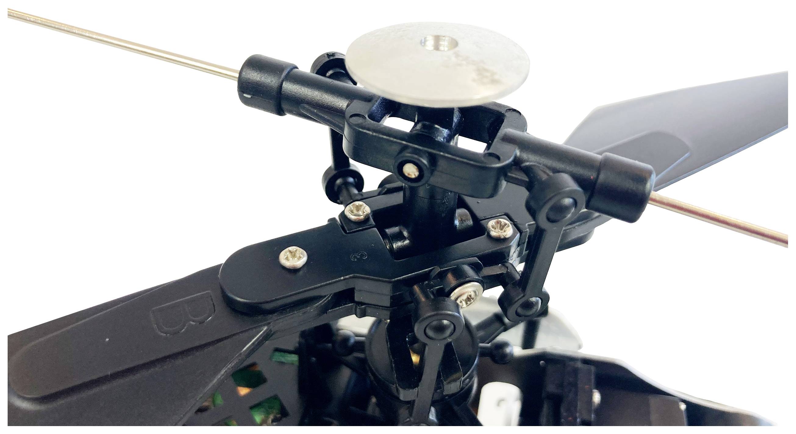 Close-up of a model helicopter rotor head with mechanics and rotor blades. Shows detailed fixings and structure.