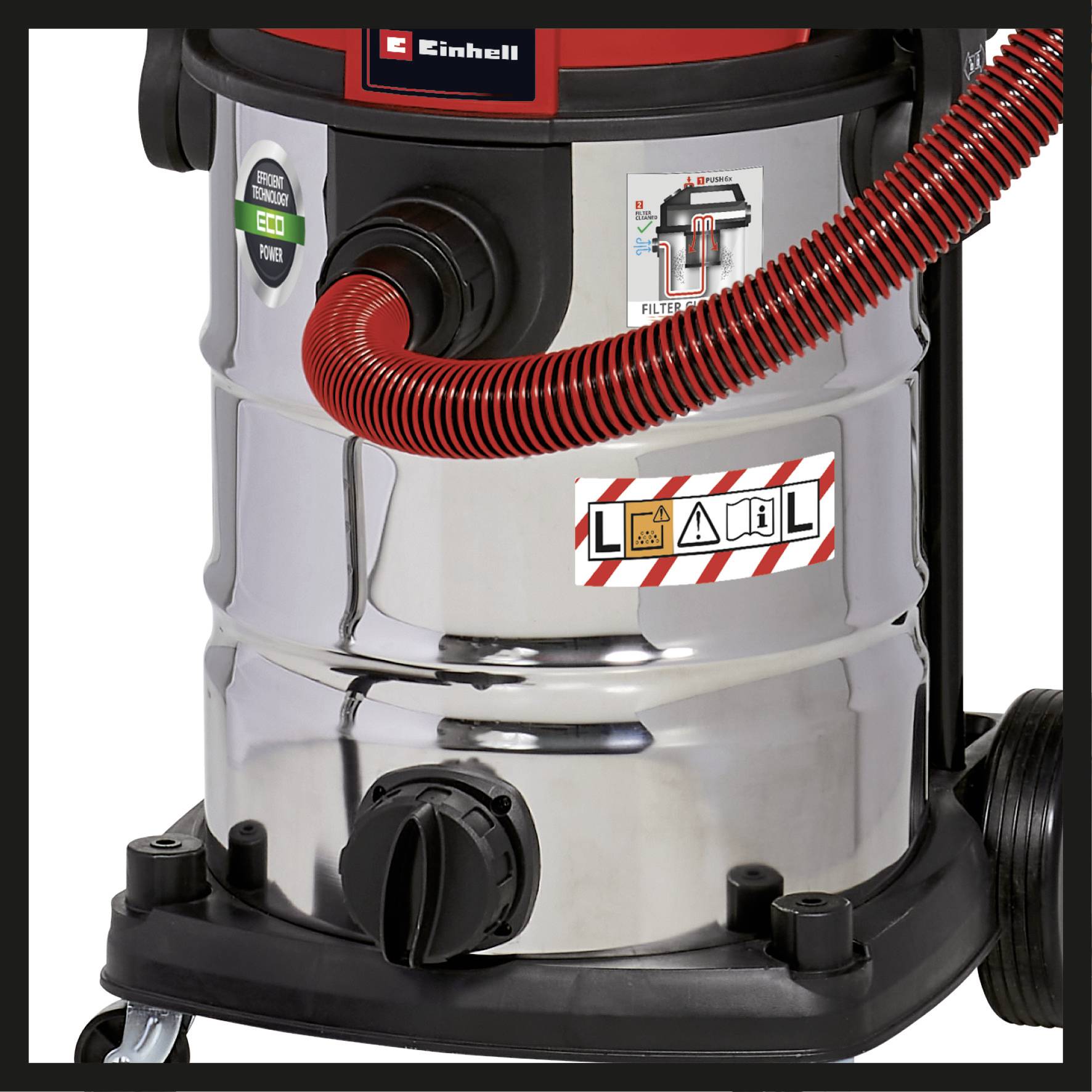 'Einhell' vacuum cleaner, chrome container, red hose connection, eco-power button, sticker with warning symbols, on wheels.