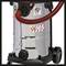 A red and black industrial vacuum cleaner with stickers and large wheels. A red hose and controls are visible.