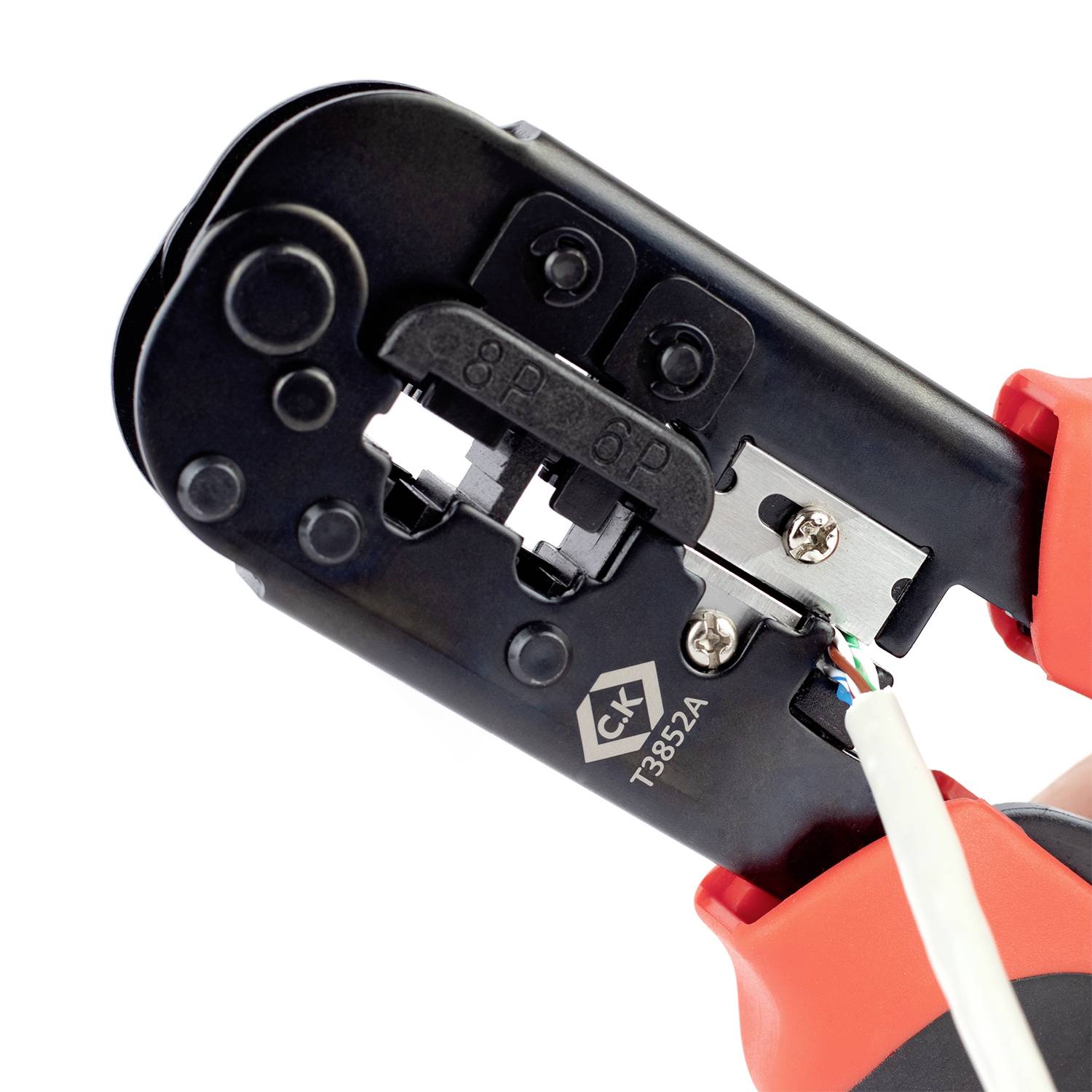 Close-up of a crimping tool processing a cable, showing the metal pliers and cable during the crimping process.
