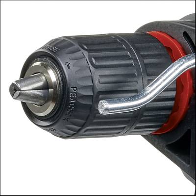 Close-up of a drill chuck with drill bit inserted and clamping lever, ready for drilling.