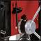 Close-up of a rotatable metal scale on a machine, likely for precise adjustments. Red background, black clamp visible.
