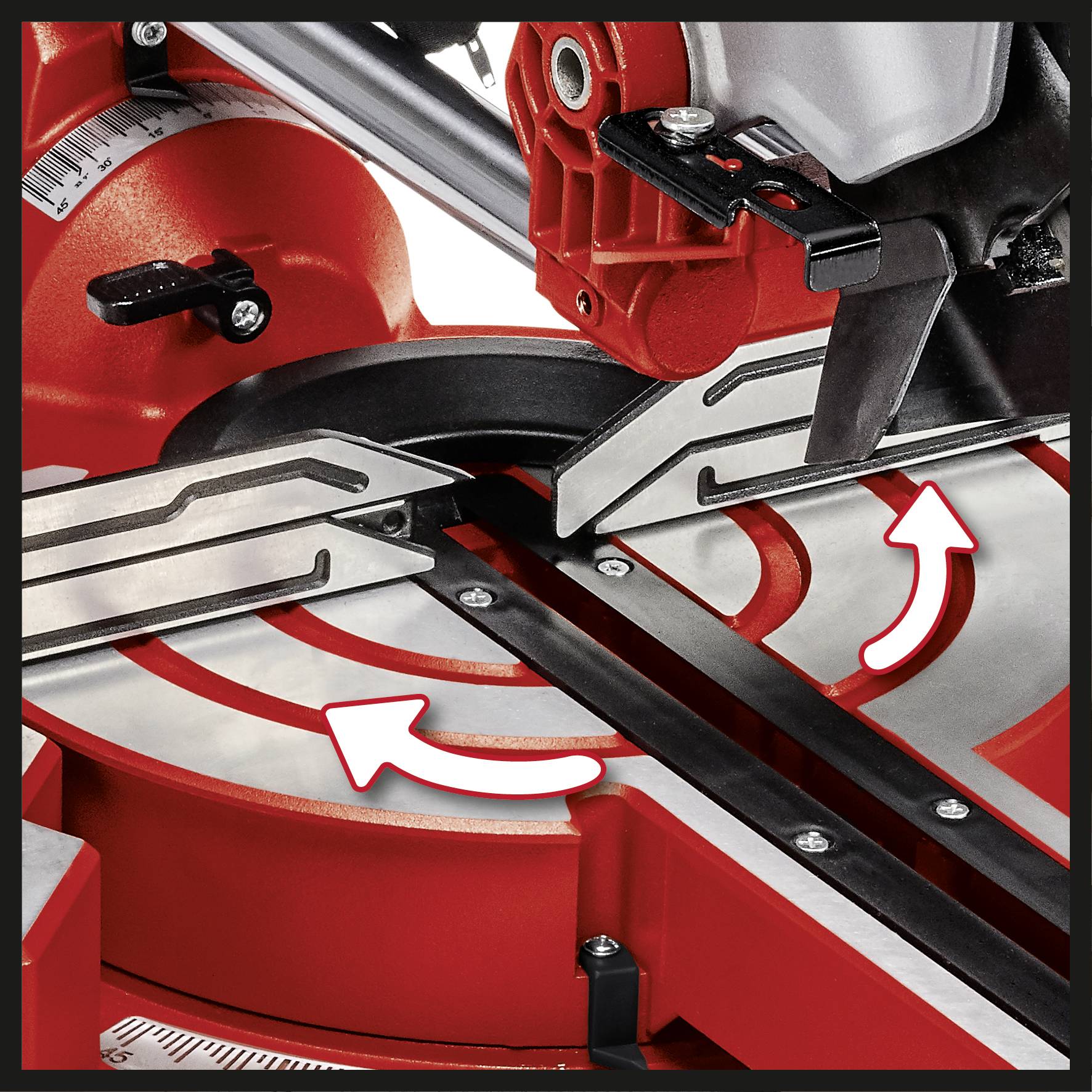 Red mitre saw with adjustable mitre angle setting; white arrows indicate the movement of the mitre guide.