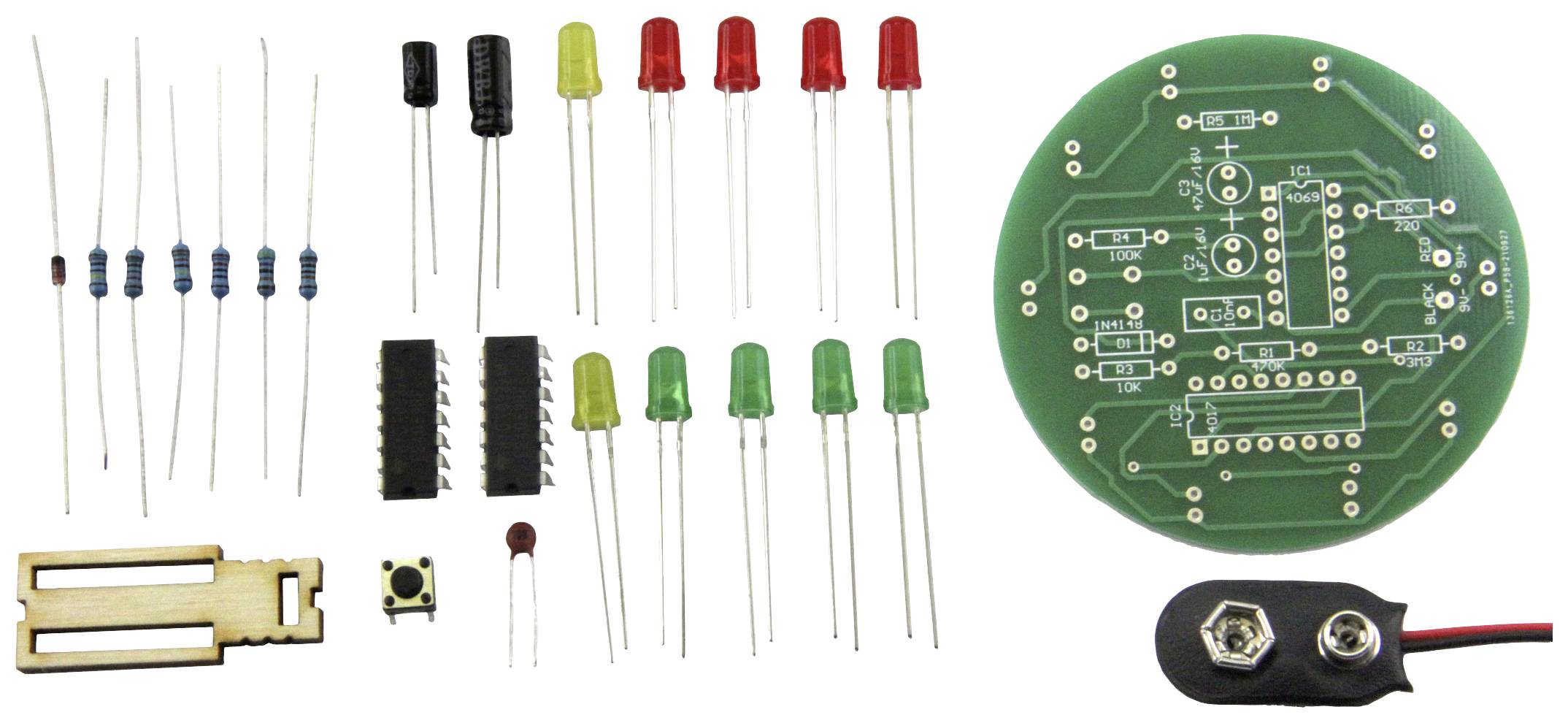 Electronic kit with resistors, LEDs, microchip, push button and circular circuit board. Includes battery clip and wooden mounting bracket.