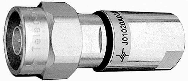 A coaxial plug with a metallic surface, shown from the side. Markings are visible but do not contain any readable details.