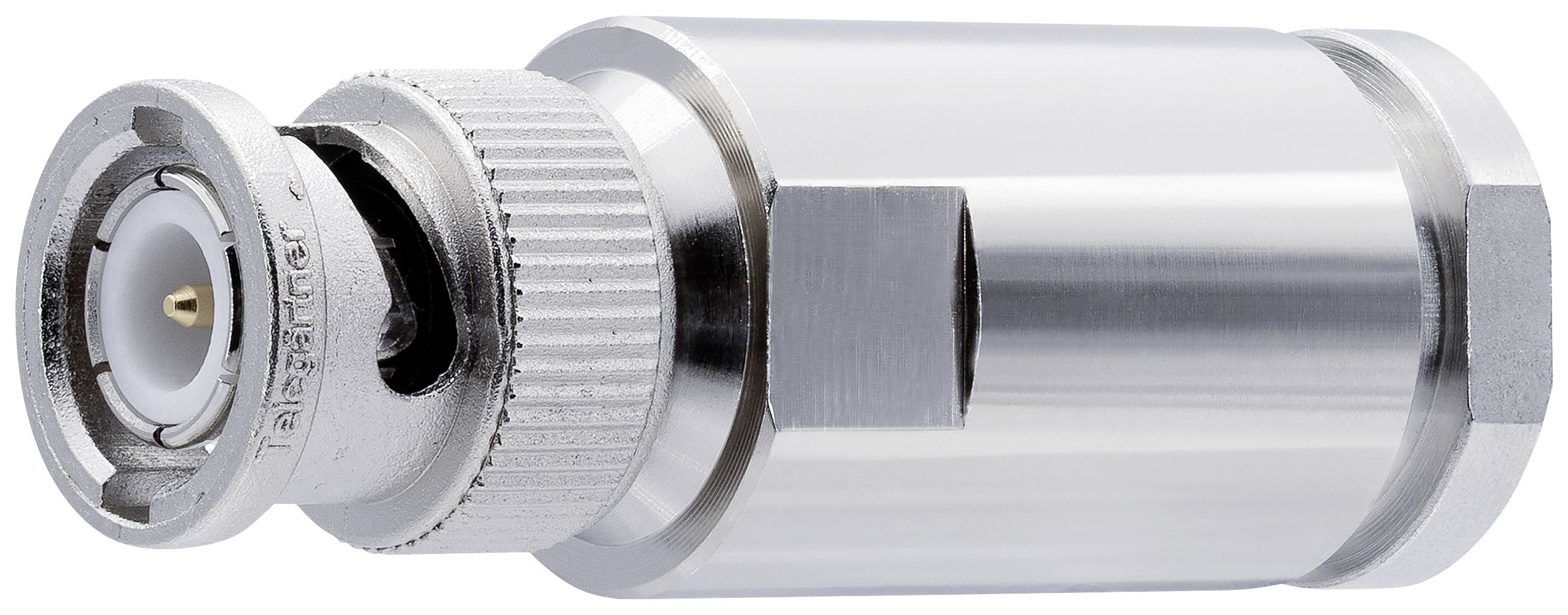A metallic coaxial plug with threading and an insulated centre pin, resting on a white surface.