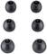 Six replacement earbuds in black, symmetrically arranged in two rows of three pieces each.