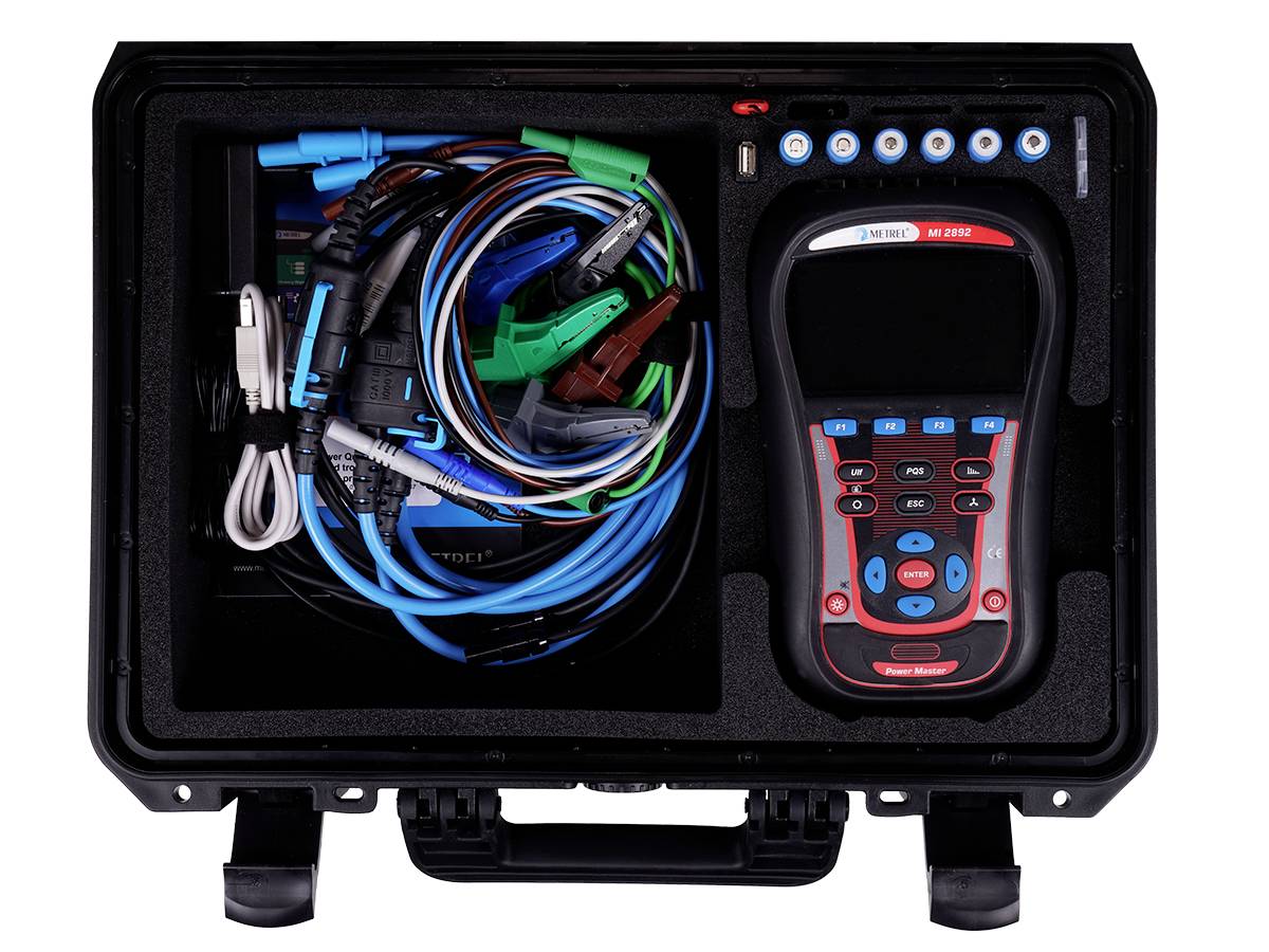 An open suitcase containing a diagnostic device and cables. The device has a display and control buttons. The cables are colour-coded.