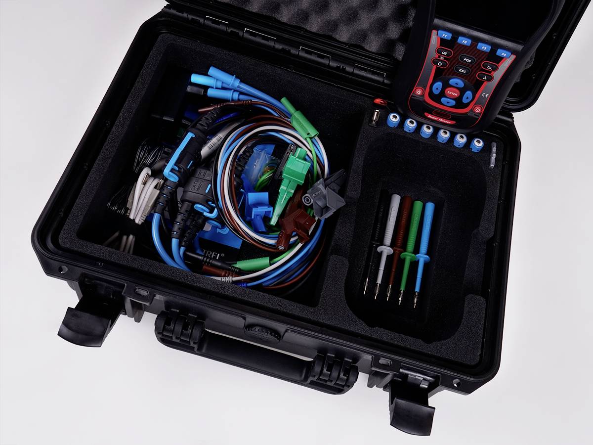 Tool case with various cables and electrical testing devices, suitable for diagnostic and repair work.