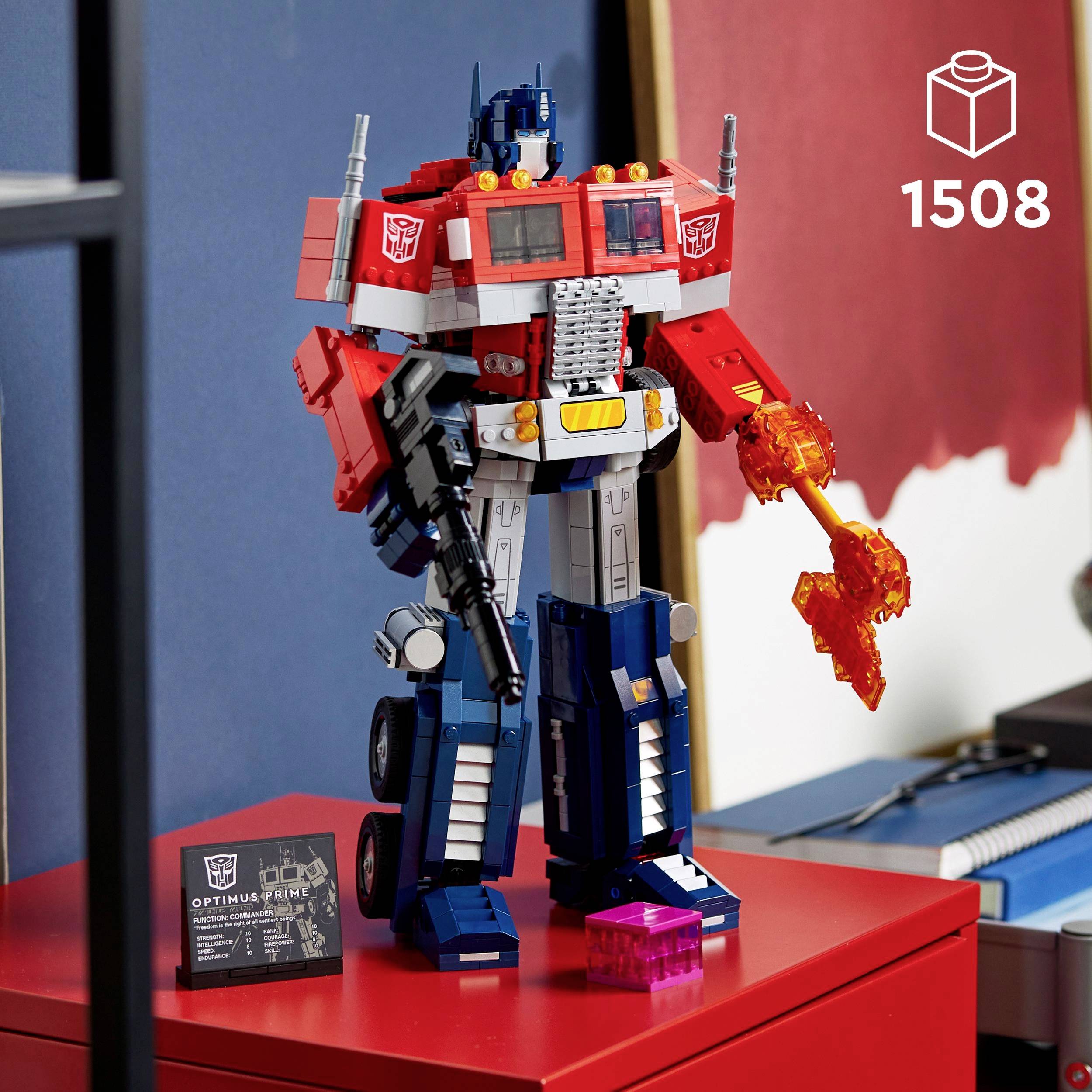 A detailed LEGO figurine of a robot stands on a red table, beside the sign indicating 1,508 pieces.