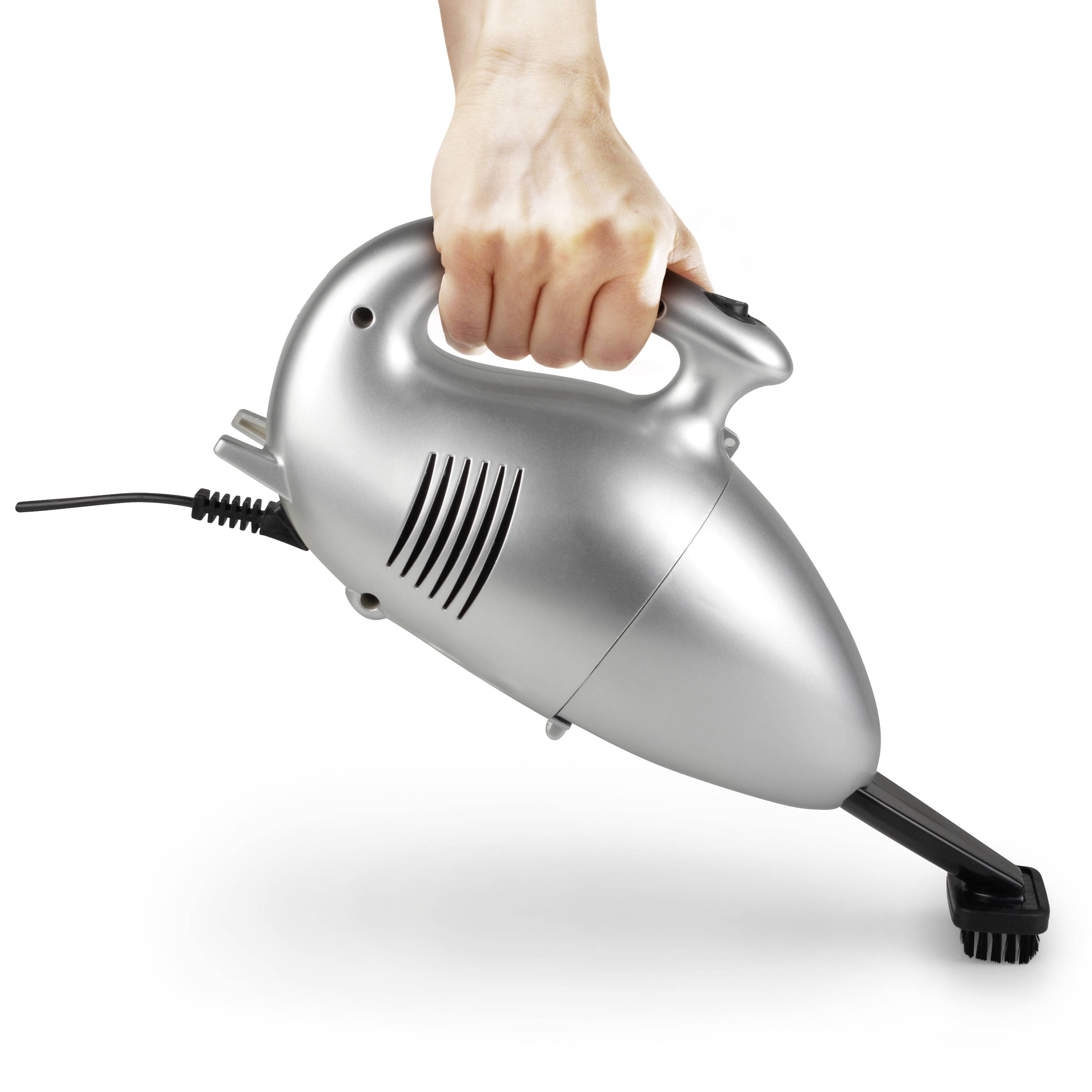 A hand is holding a silver handheld vacuum cleaner at a right angle, ready for cleaning, with the power cord visibly connected.