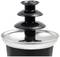 'Three-tier chocolate fountain made of black plastic and stainless steel, perfect for desserts and buffet presentations.'