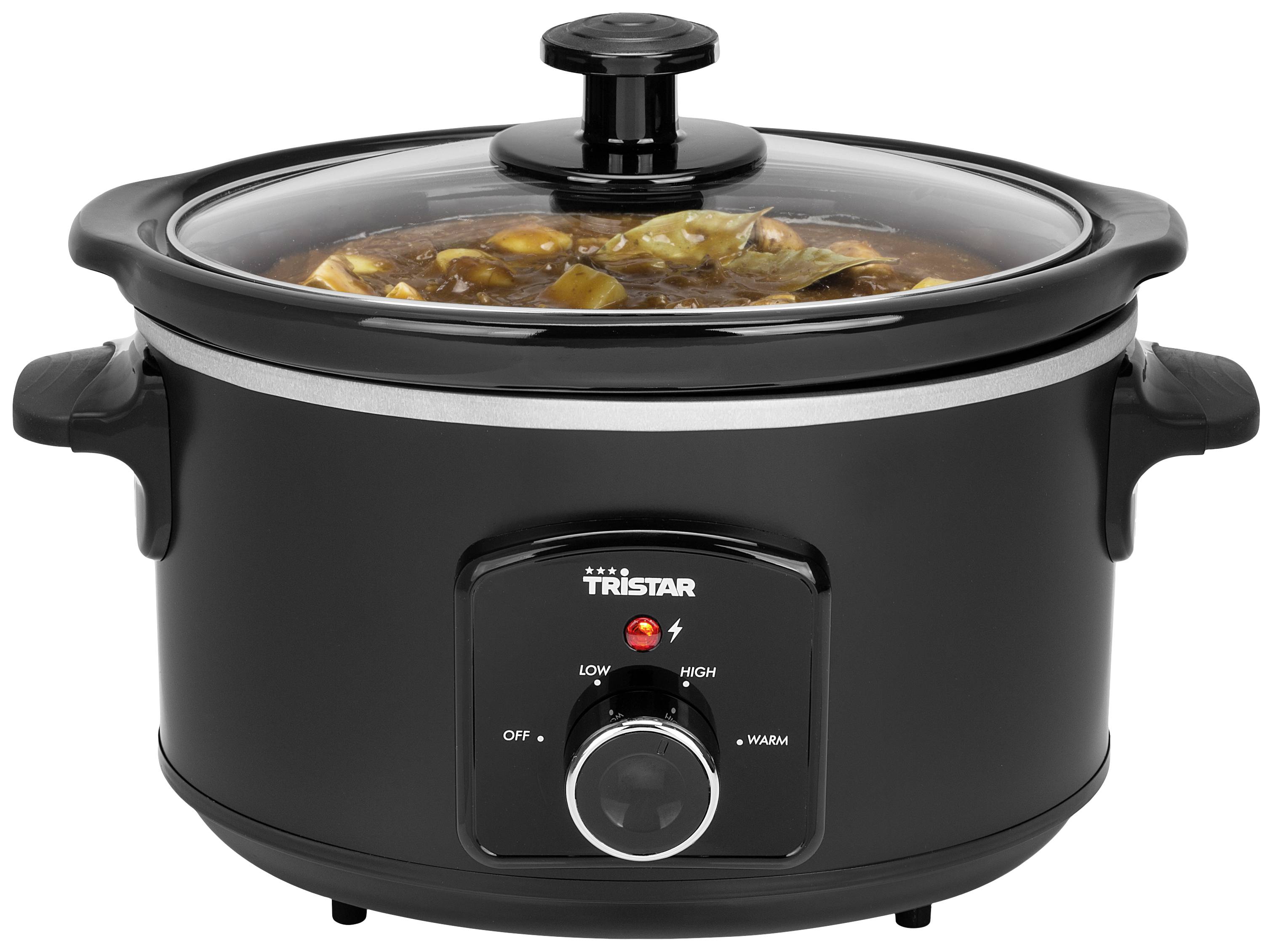 A black slow cooker with soup ingredients. The rotary switch on the front shows the settings: Warm, Low, High.