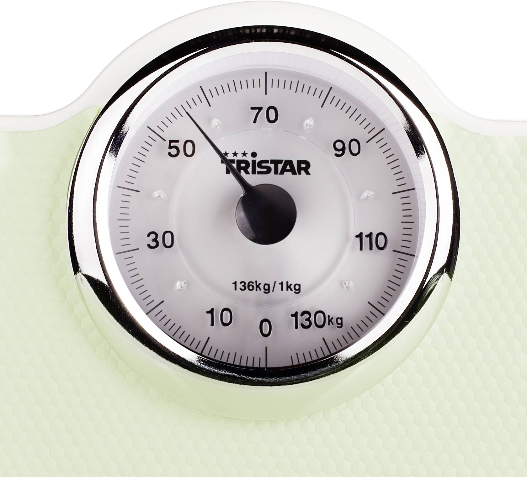 An analogue scales shows 70 kilograms. The dial has markings from 0 to 130 kg and a label named 'Tristar'.