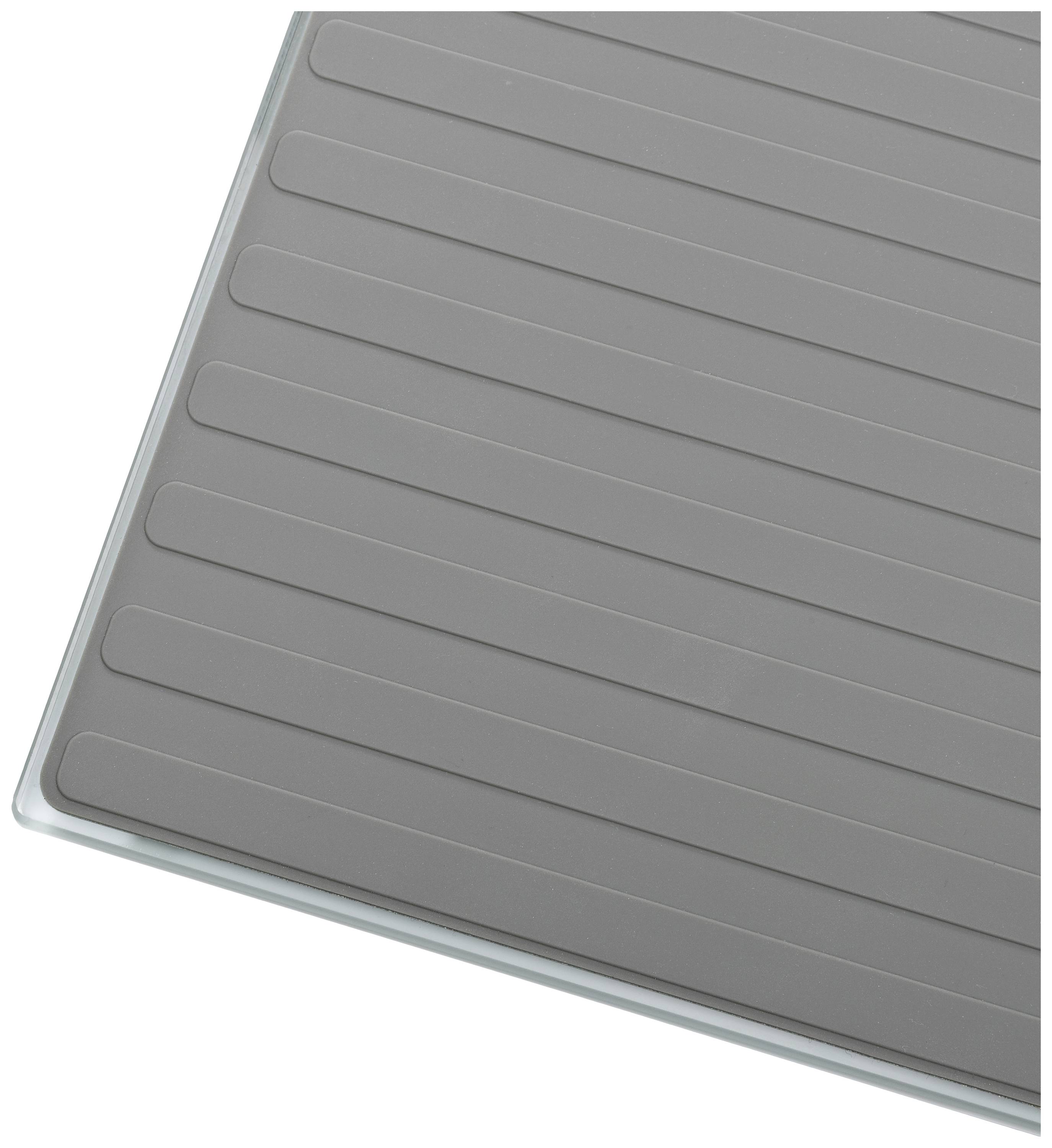 Grey, rectangular silicone mat with parallel line pattern.