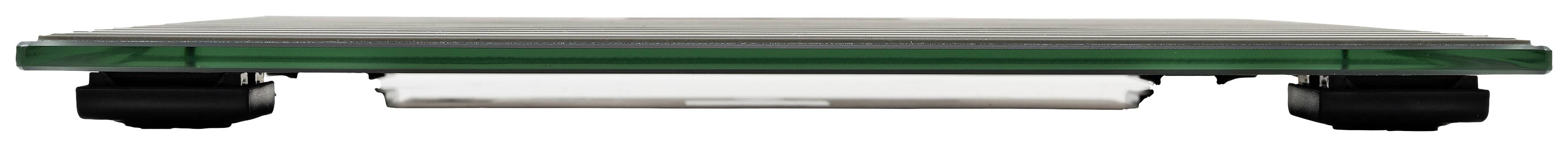 A flat, rectangular glass construction with a green border rests on black legs.