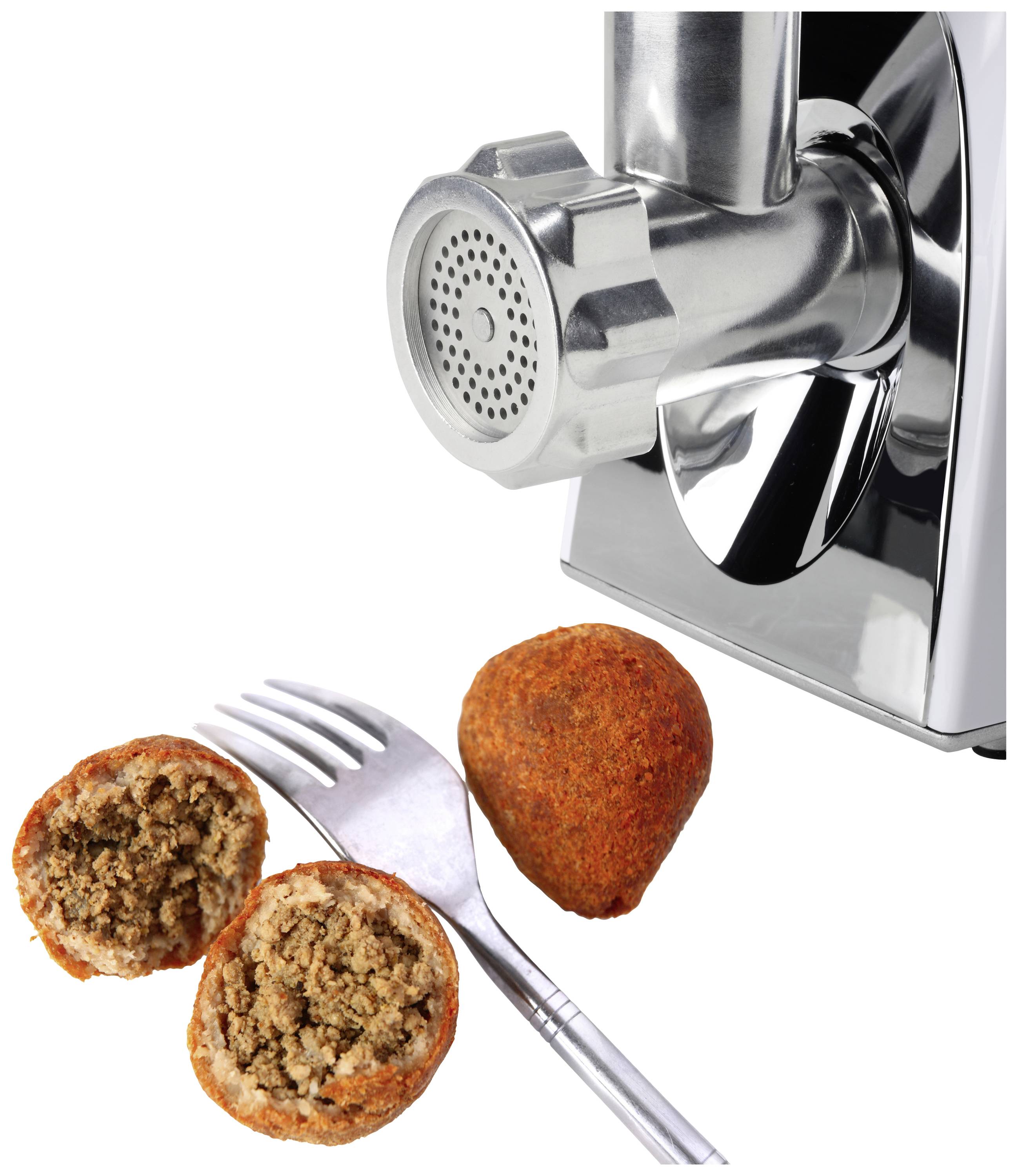 Metal mincer next to an opened and a whole filled pasty with cutlery.