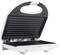 An open sandwich toaster with a ridged grill plate, ready for toasting. The appliance is white with a black interior.