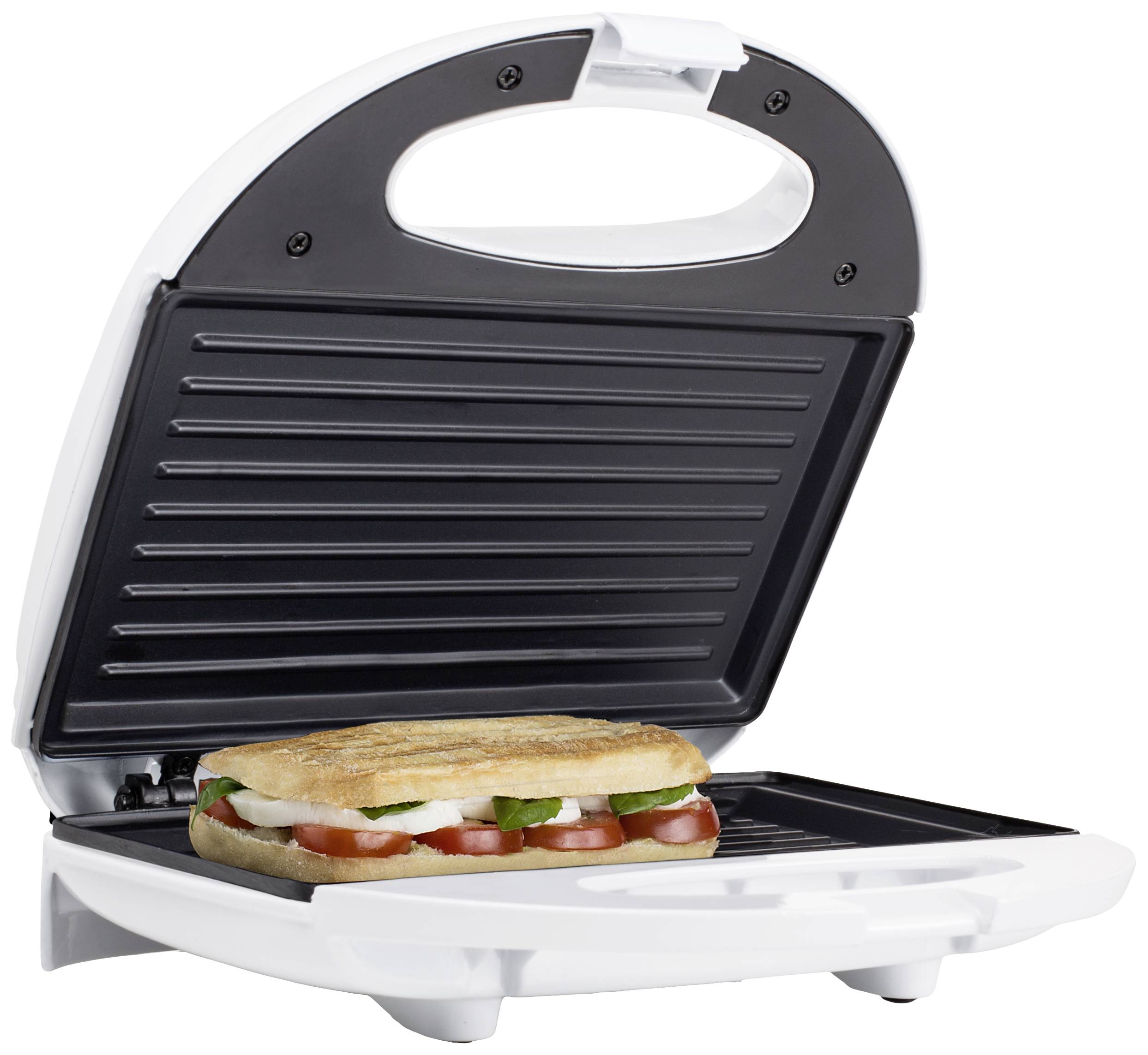 A sandwich toaster with its lid open is grilling a filled panini with tomatoes, cheese, and basil.