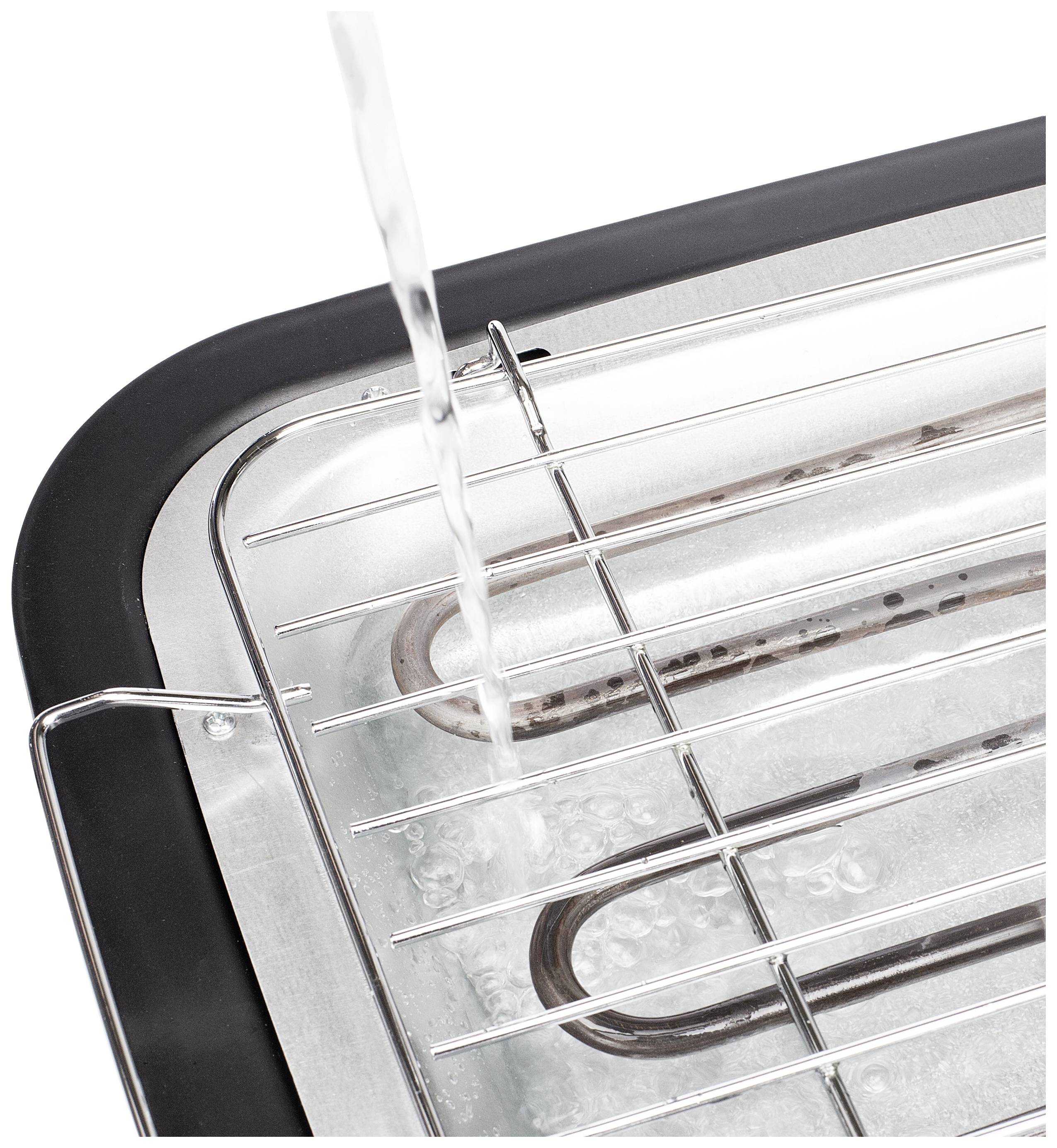 Water is poured over a barbecue grill into a metal drip tray.