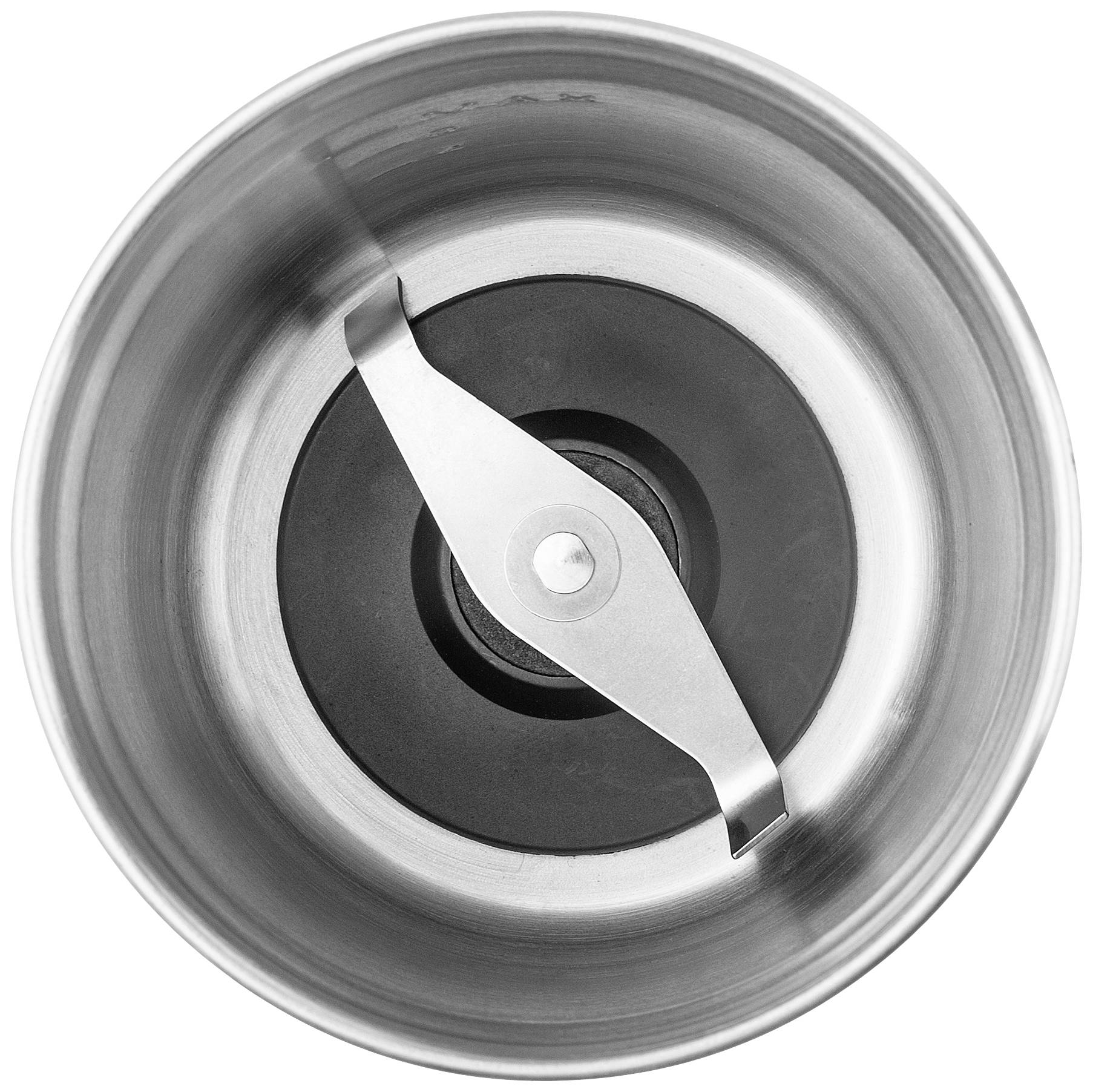 Top-down view of an empty coffee grinder with two sharp blades in a round, metallic chamber.