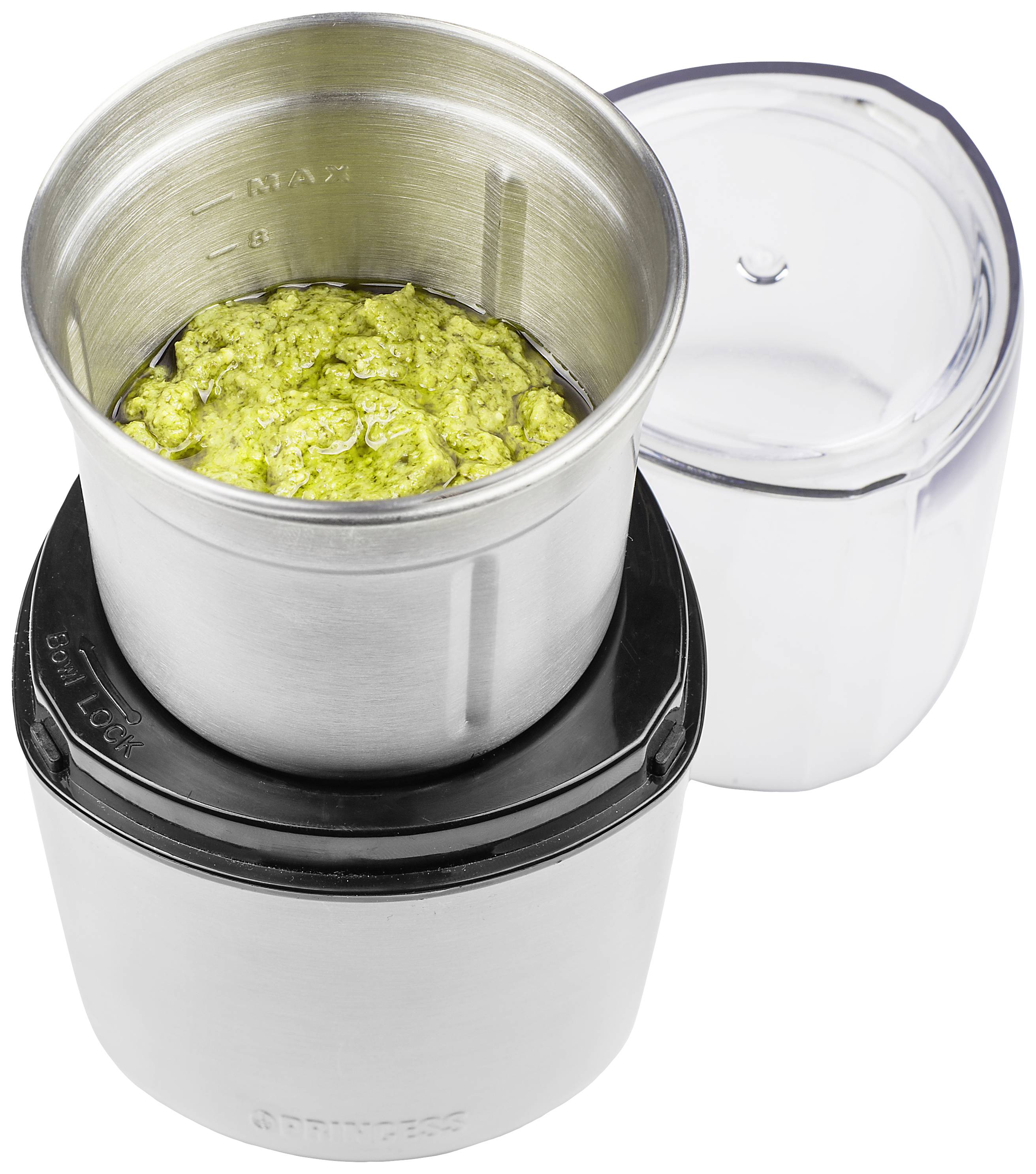 Silver coffee grinder with an open lid, filled with ground coffee.