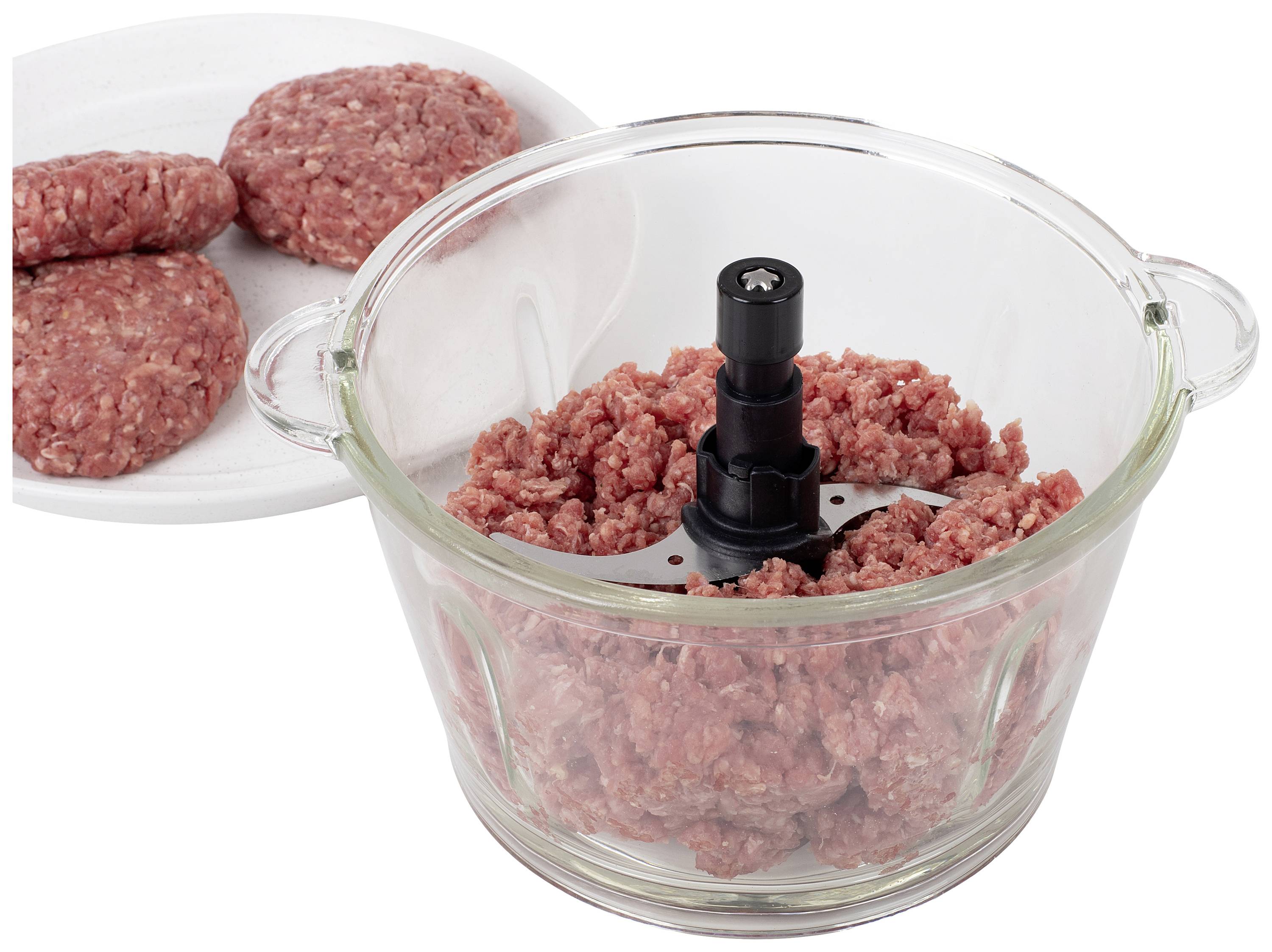 Glass bowl with minced meat in a blender, next to a plate with shaped meat patties on a white background.<br><br>Glass bowl with mince in a food processor, beside a plate with shaped burger patties on a white background.