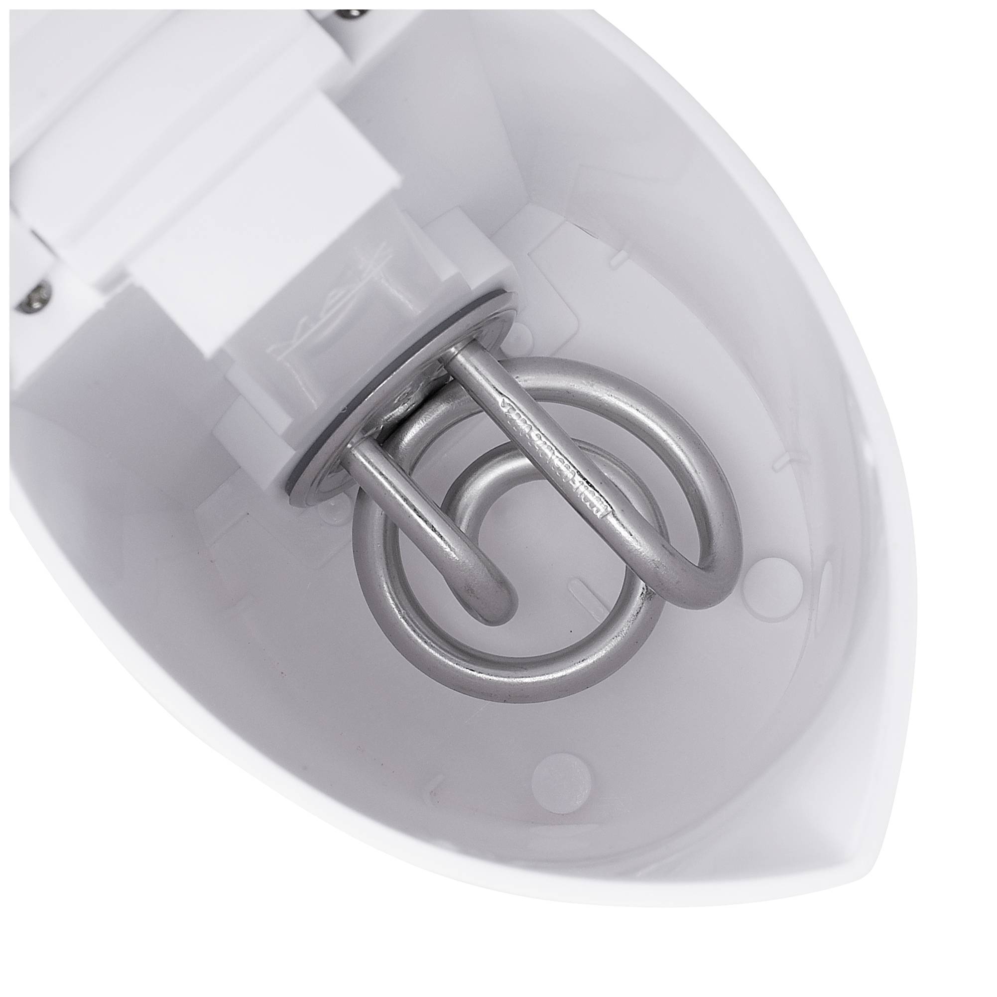 A white kettle viewed from above, revealing the silver heating coil inside.